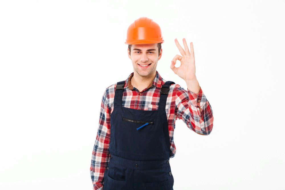 portrait of a cheerful young male builder